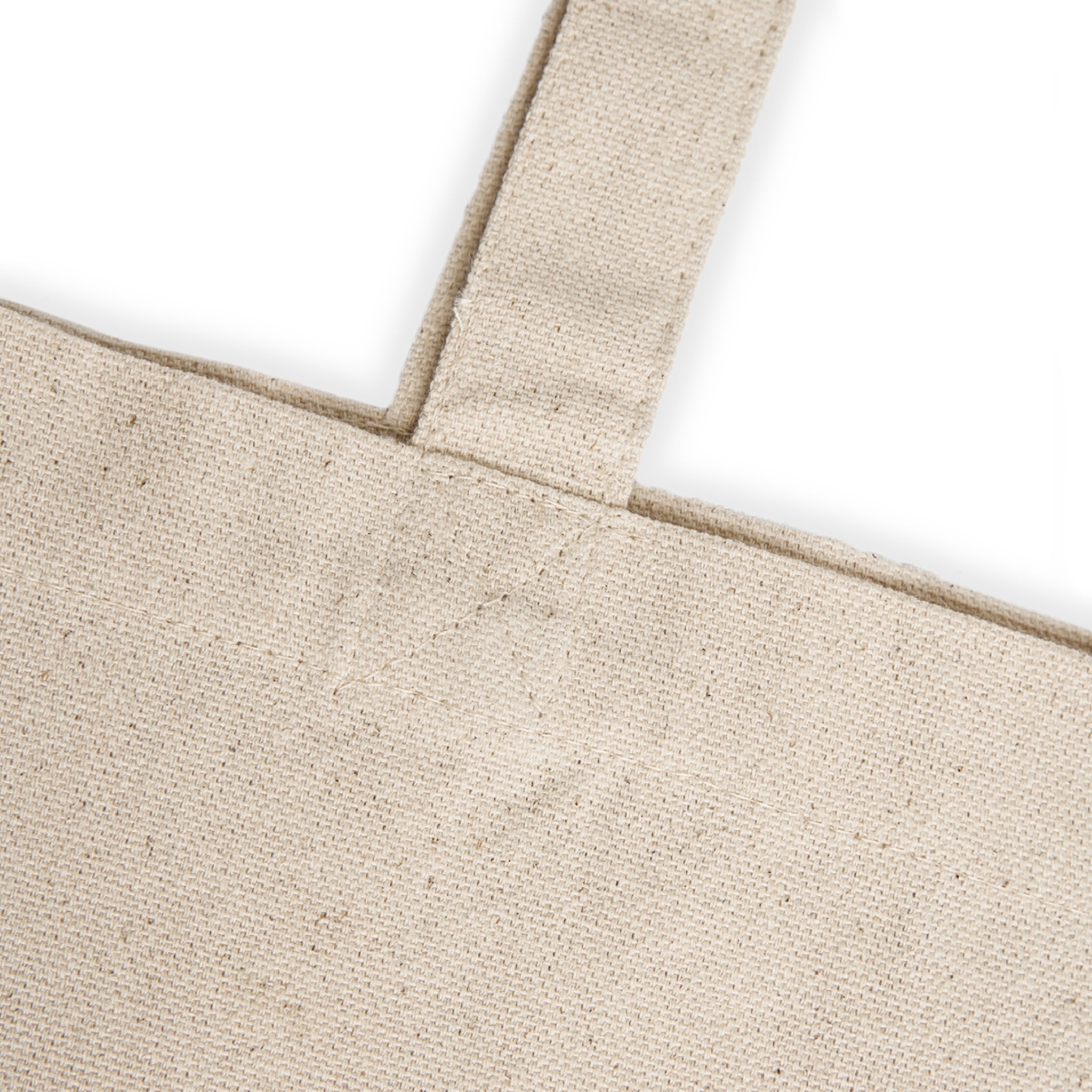 Close-up of a beige tote bag with a white background