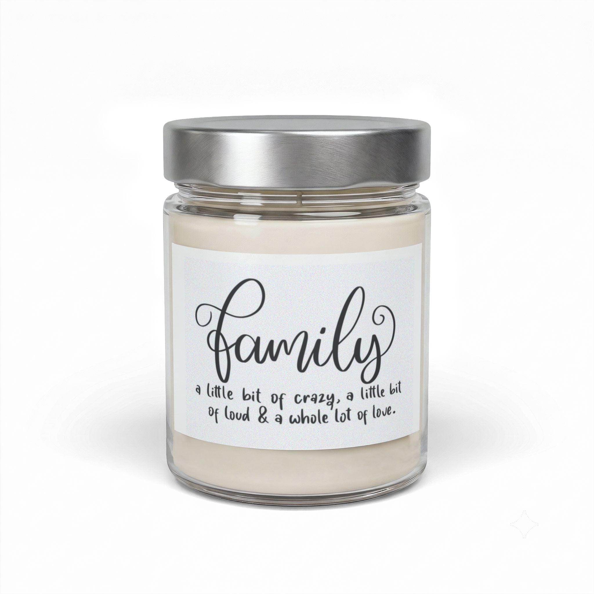 A single-wick jar candle with cream-colored wax and a metallic silver lid, featuring a white label with the word 'family' in black script and the quote 'a little bit of crazy, a little bit of food & a whole lot of love.' on a white background.