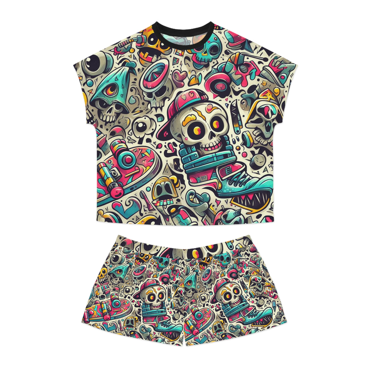 A two-piece women's pyjamas set consisting of a short-sleeve crop top and matching shorts, both featuring a vibrant, all-over cartoon graphic print of skulls, sneakers, and retro tech motifs on a cream background.