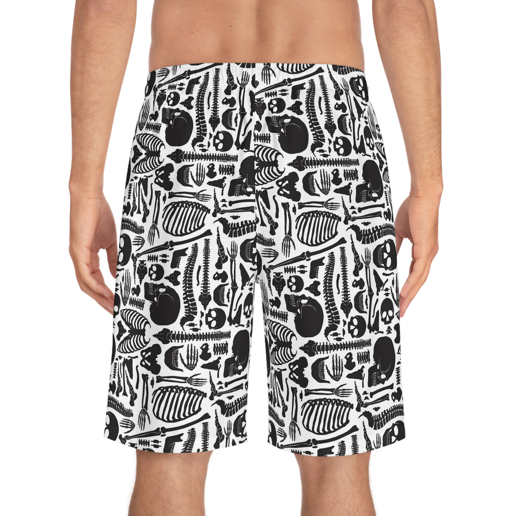 Person wearing black and white patterned shorts on a white background