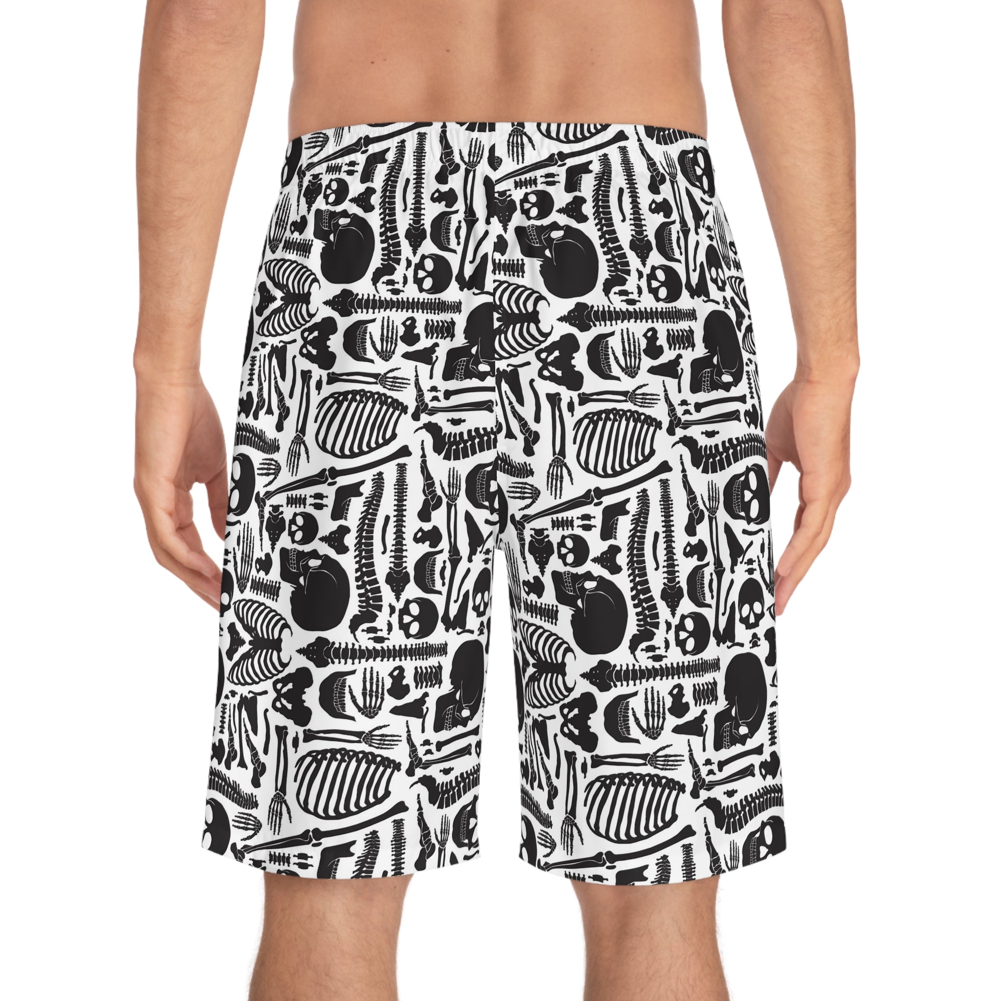 Person wearing black and white patterned shorts on a white background