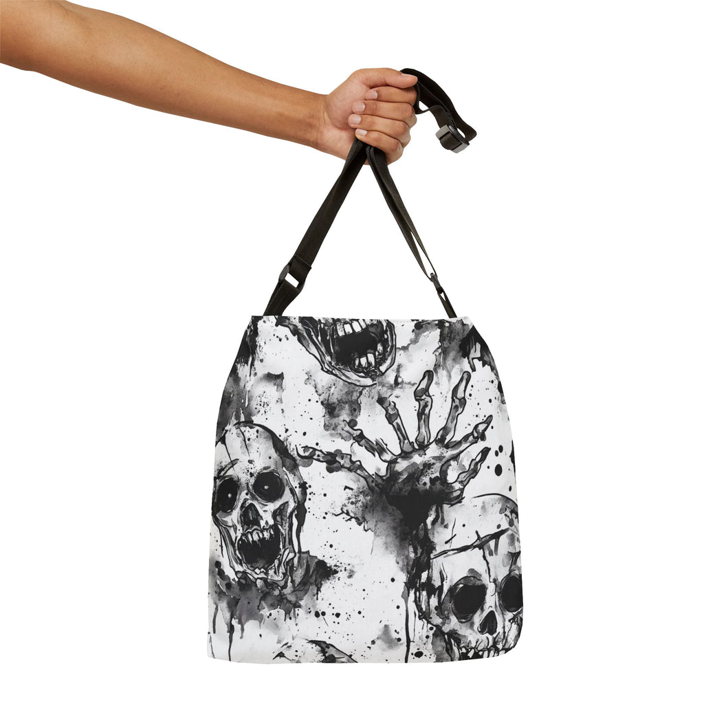 Bag with skull and hand design held by a hand on a white background