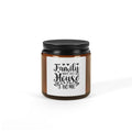 An amber glass jar candle with a black metal lid and a white label that reads 'Family WHEE WHEN THIS House A HOME' in black script, shown on a clean white background.