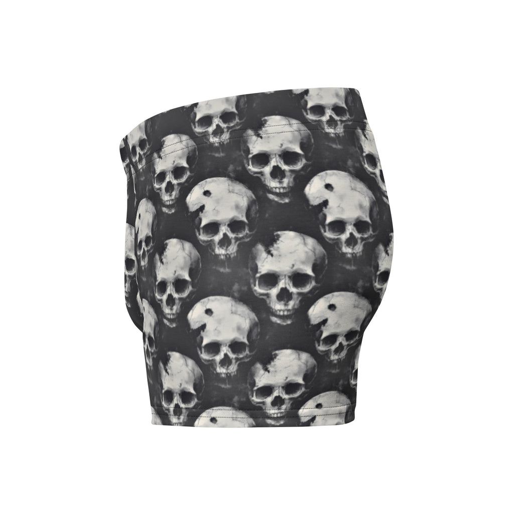 Black and white patterned shorts featuring an all-over repeating skull print, shown against a plain white background.