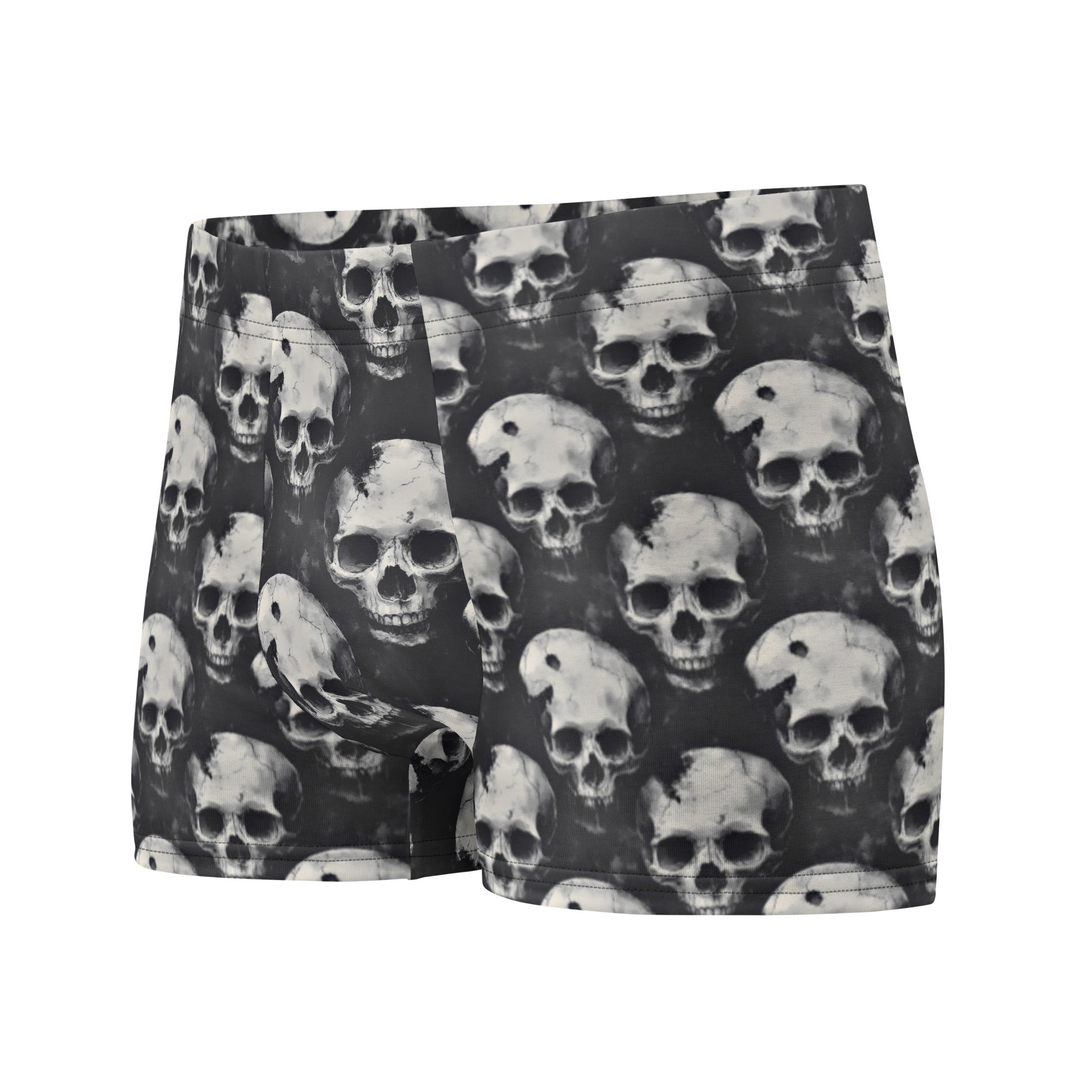 Black boxer briefs featuring an all-over repeating skull print in shades of gray and white, shown against a plain white background.