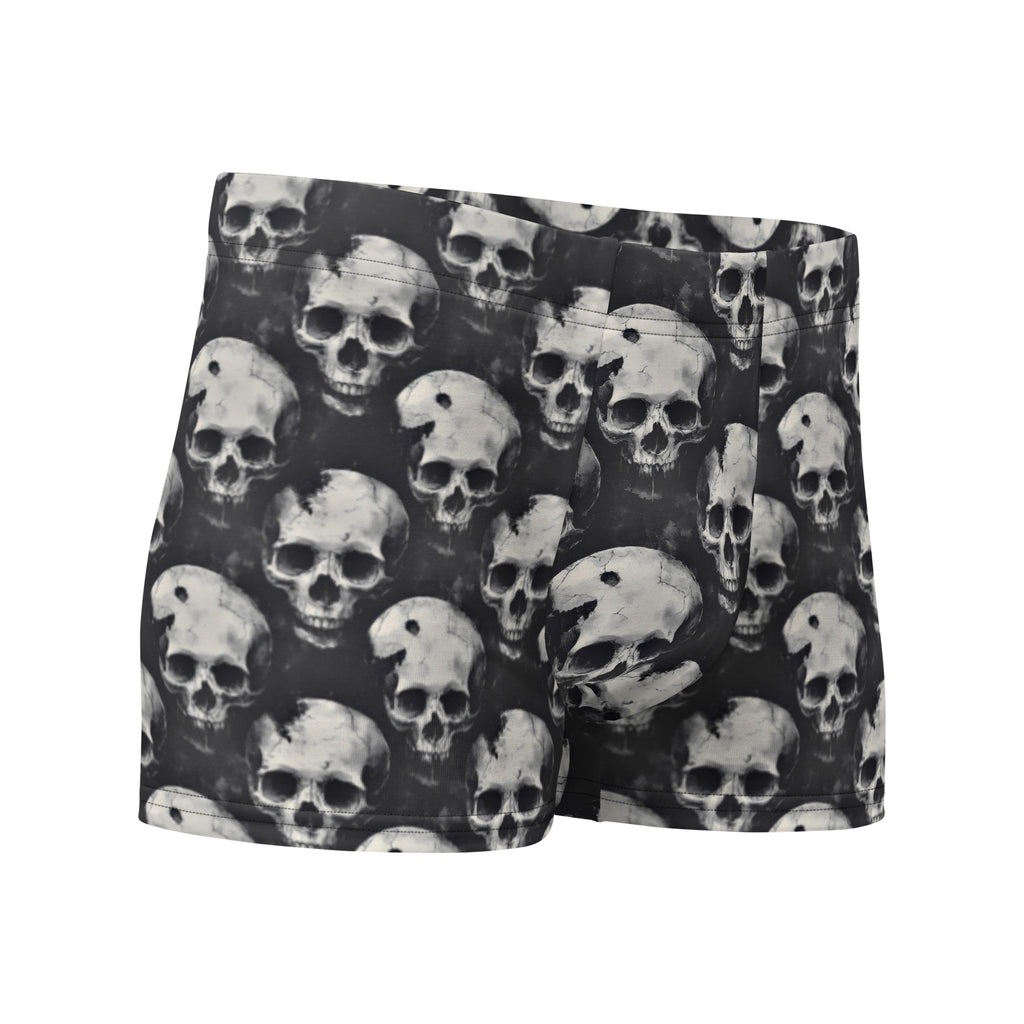 Black boxer briefs featuring an all-over repeating grayscale skull print, shown against a plain white background.