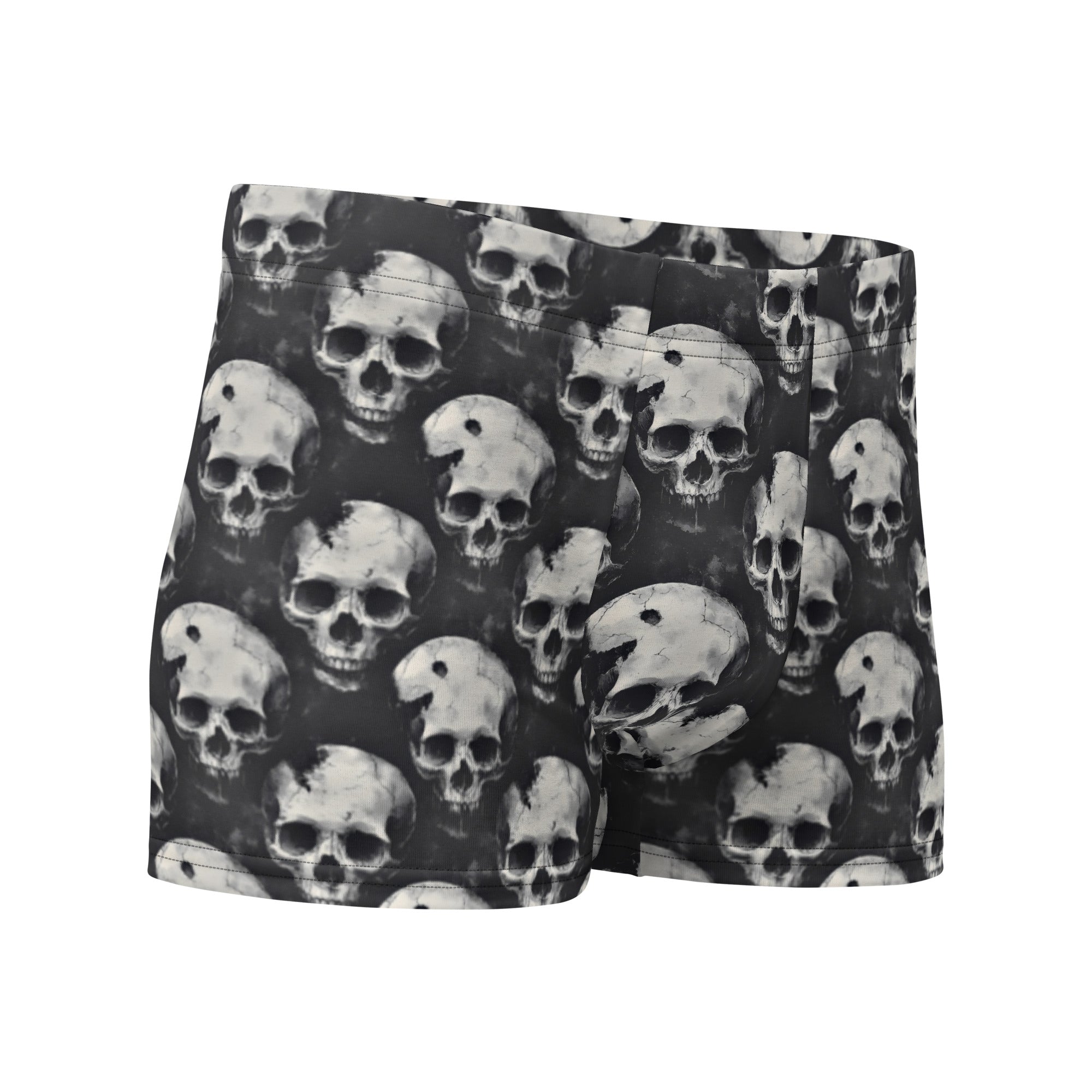 Black boxer briefs featuring an all-over repeating grayscale skull print, shown against a plain white background.