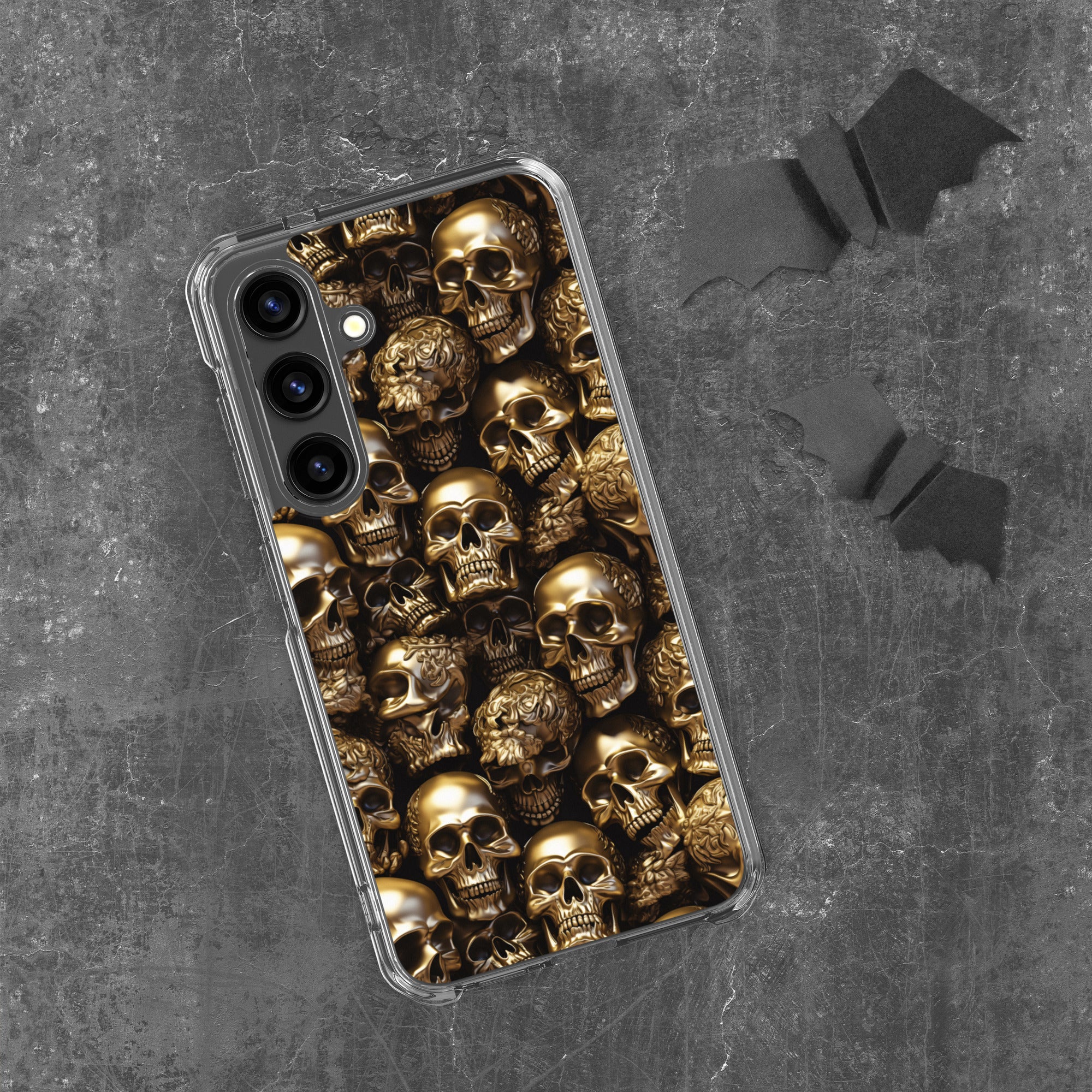 Phone case with gold skull design on a dark textured background