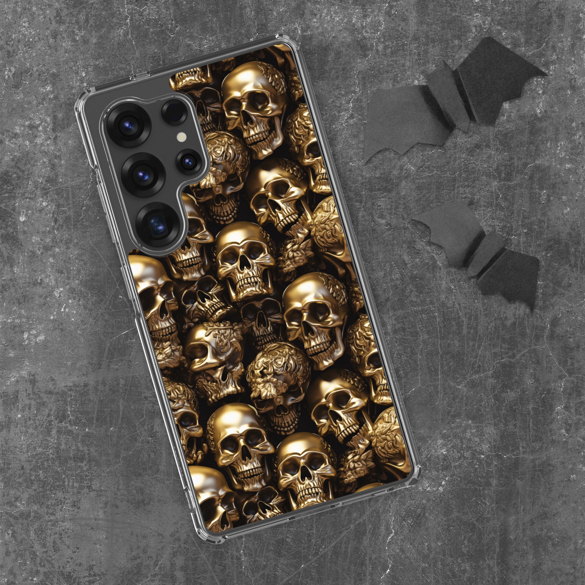 Phone case with golden skulls on a black background