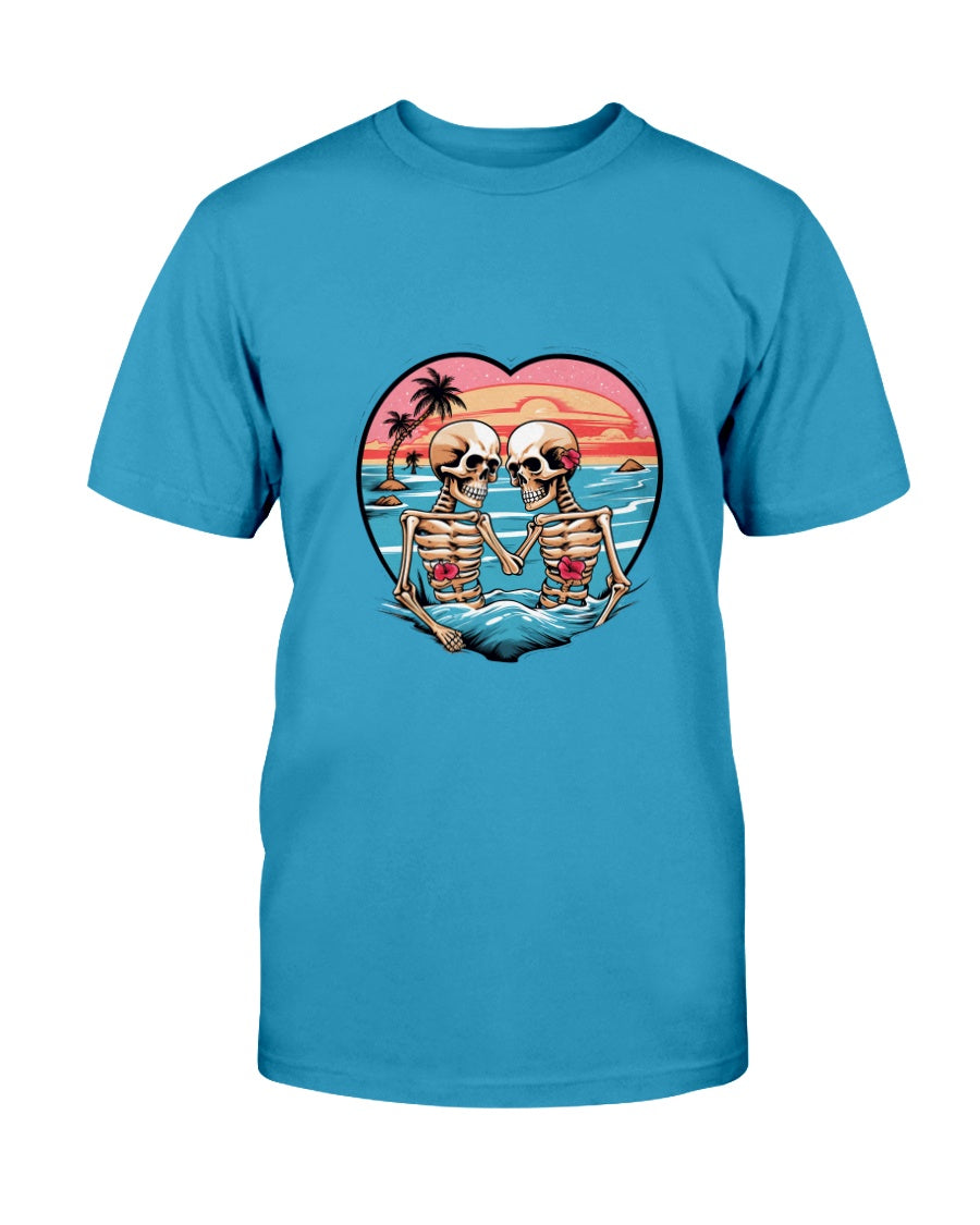 Blue t-shirt with a graphic of two skeletons on a beach, forming a heart shape, against a sunset background.