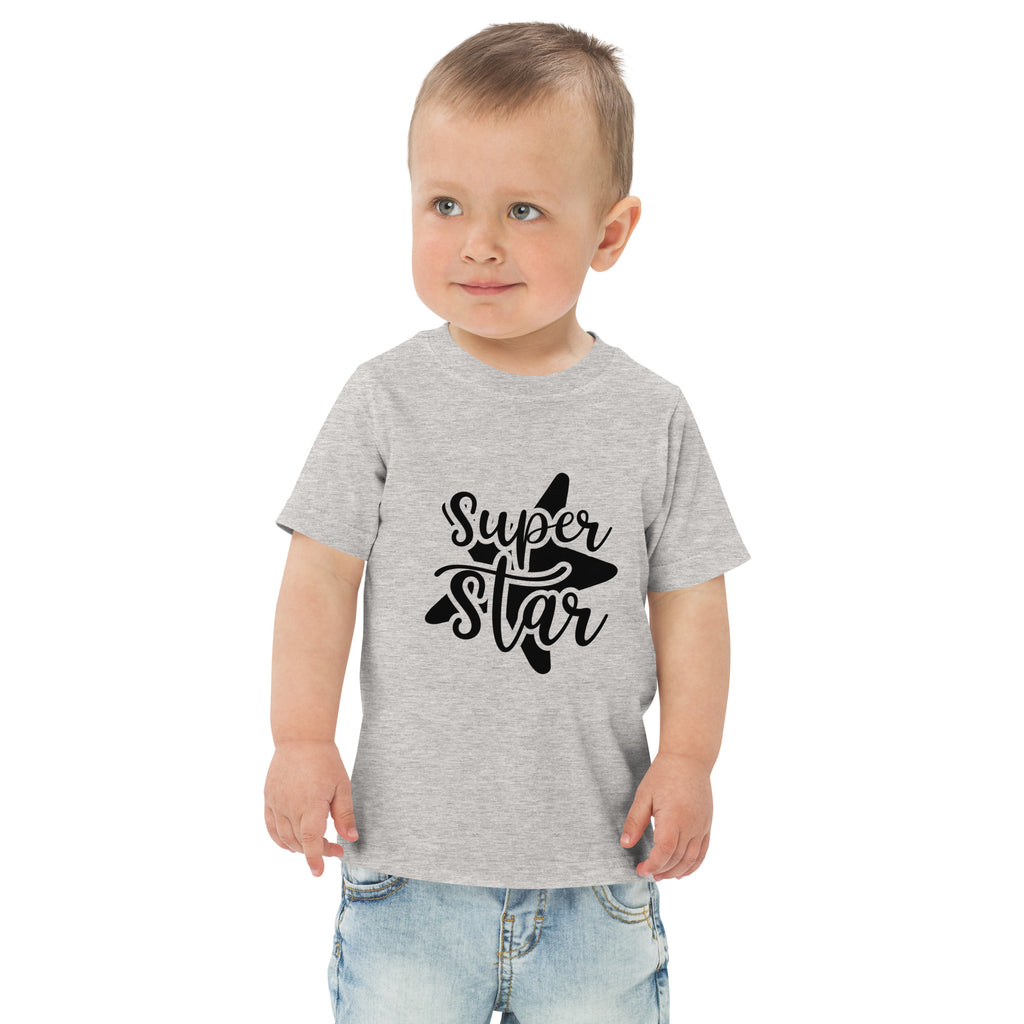 Child wearing a gray t-shirt with 'Super Star' text and star graphic on a white background