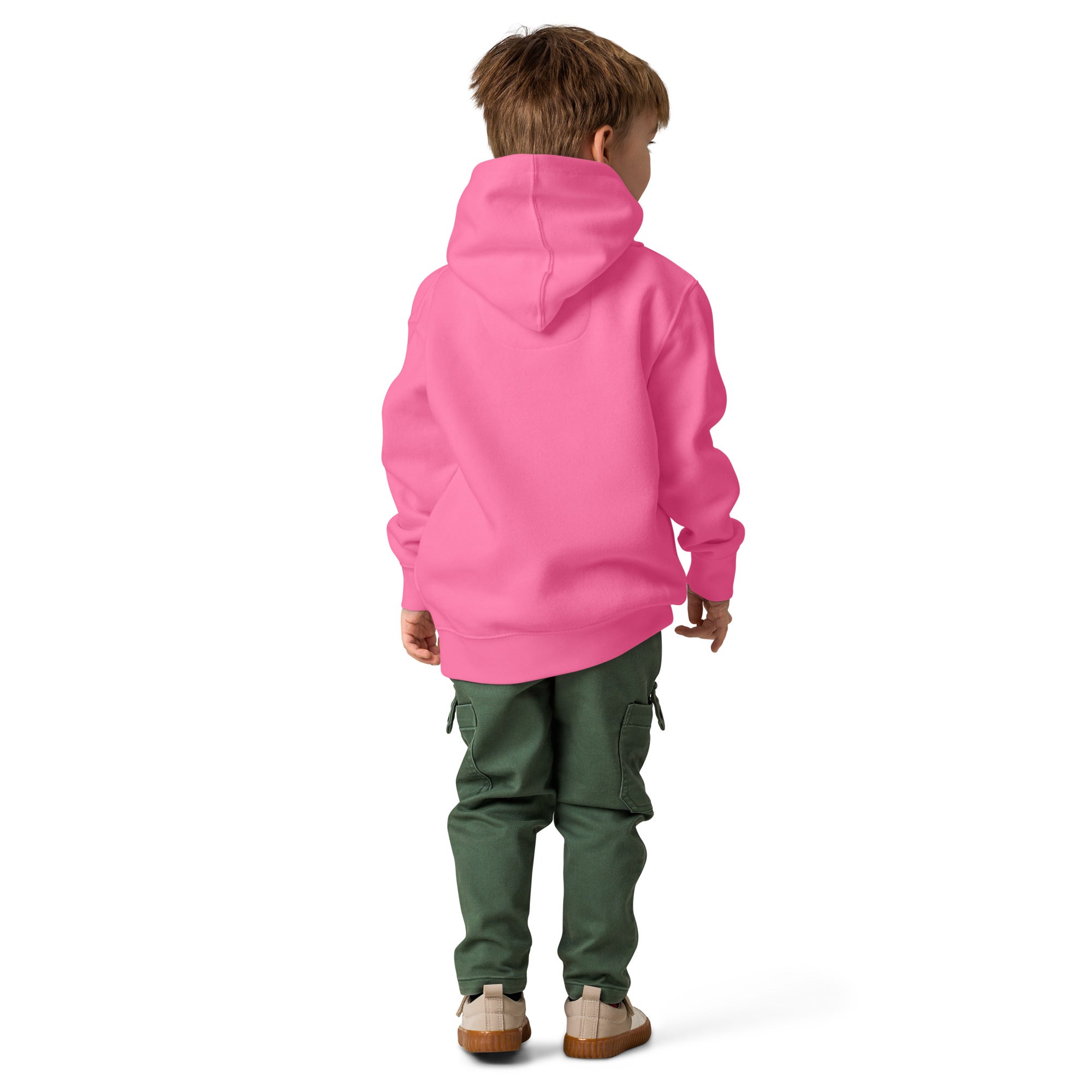 Child wearing a pink hoodie and green pants on a white background
