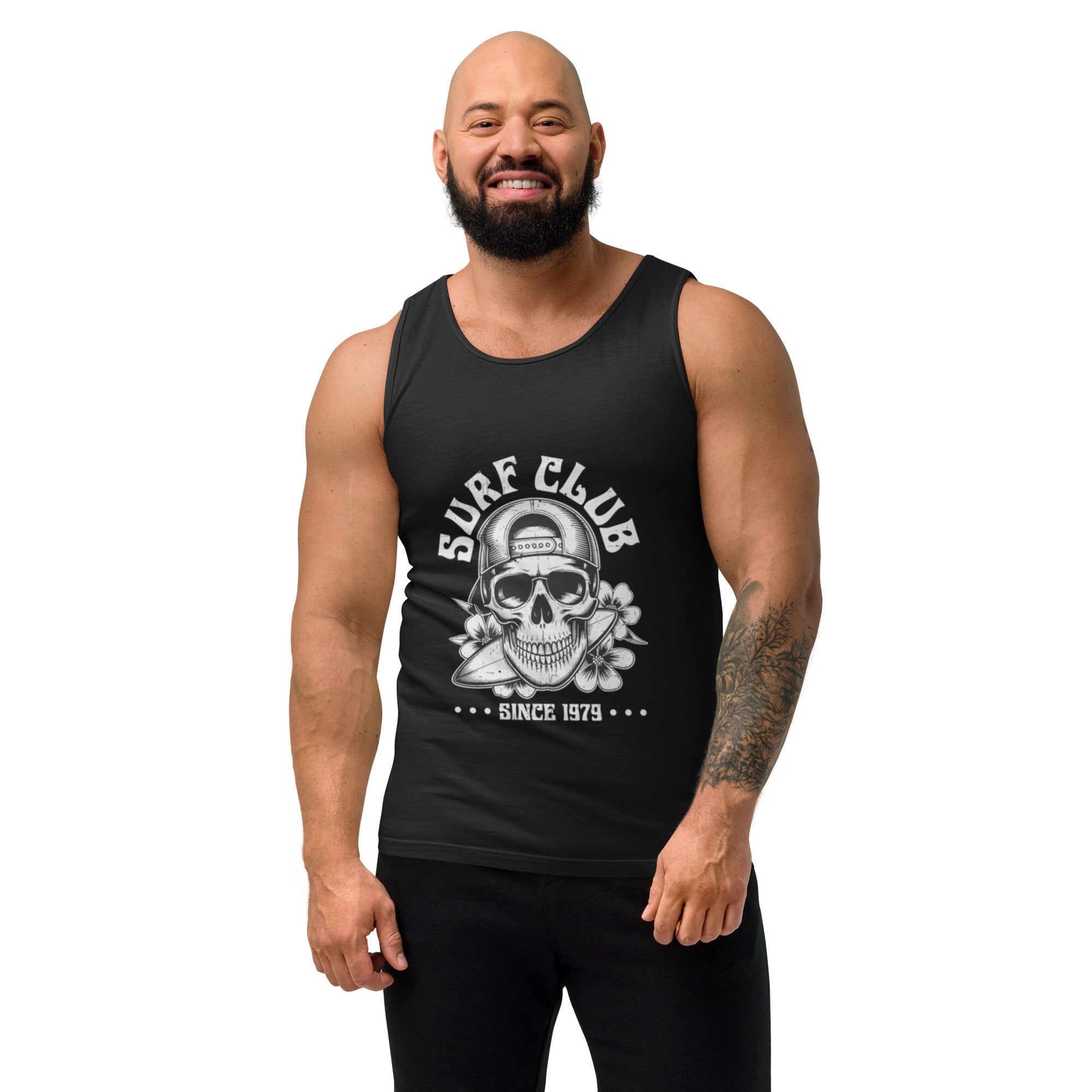 A muscular man with a beard wearing a black tank top with a cream-colored graphic that reads surf club