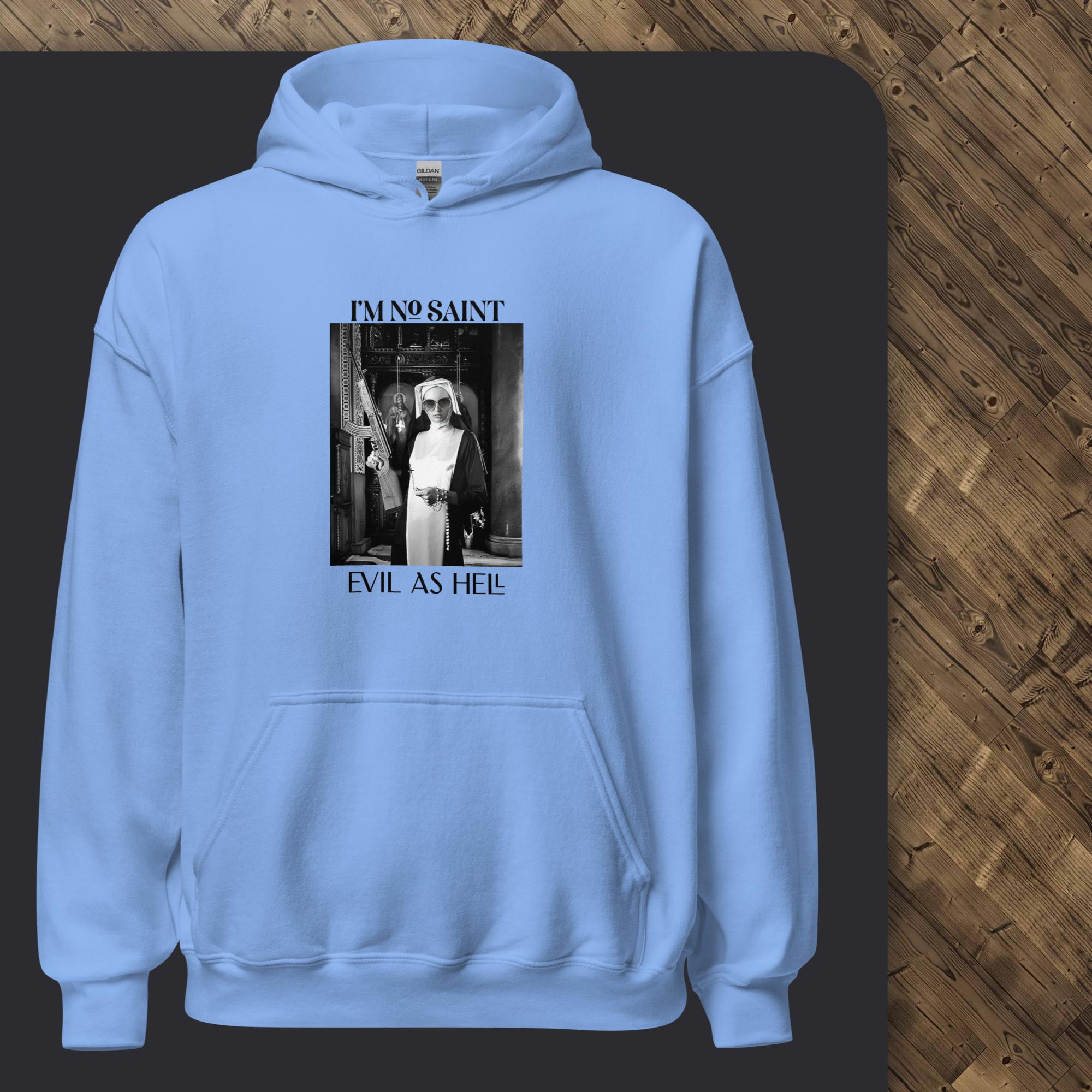 Light blue hoodie with graphic design on a dark surface