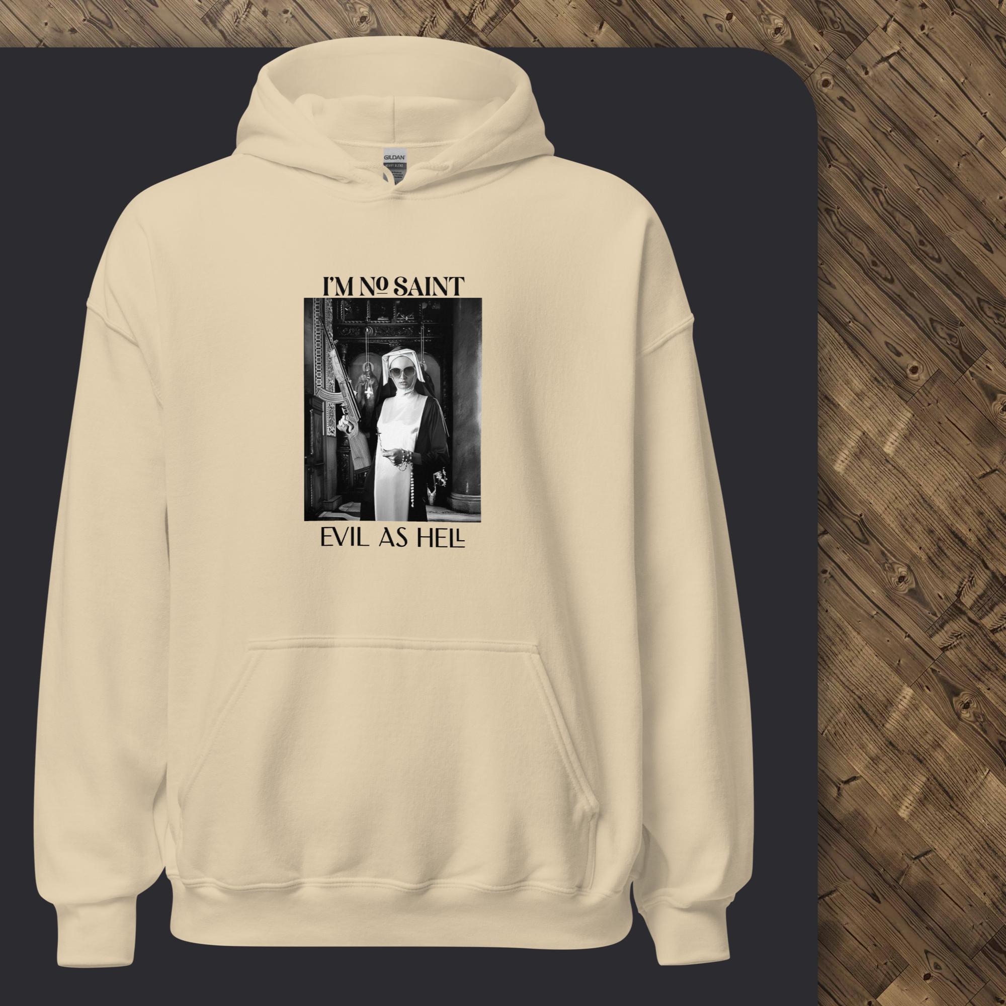 Beige hoodie with graphic design on a dark surface