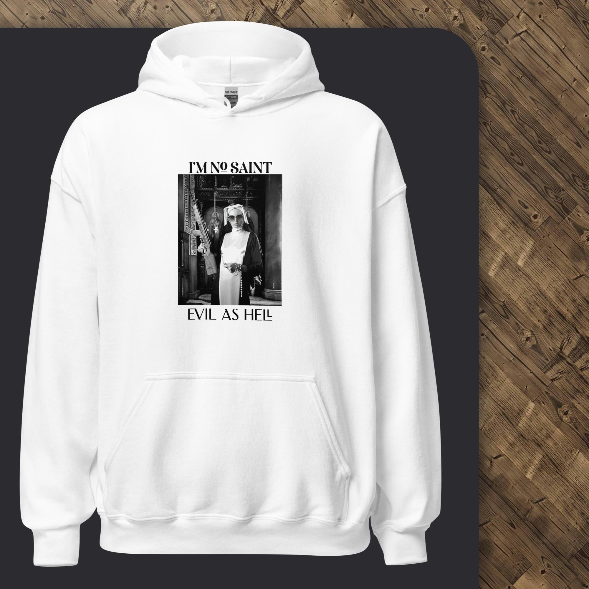 White hoodie with graphic design on a black surface