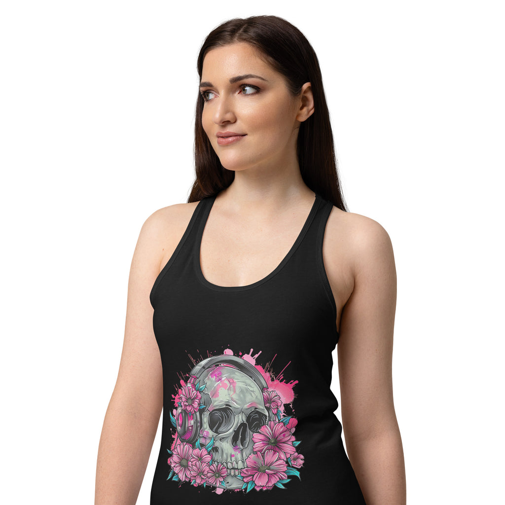 A woman wearing a black racerback tank top with a colorful graphic of a skull surrounded by pink flowers and teal accents, set against a plain white background.